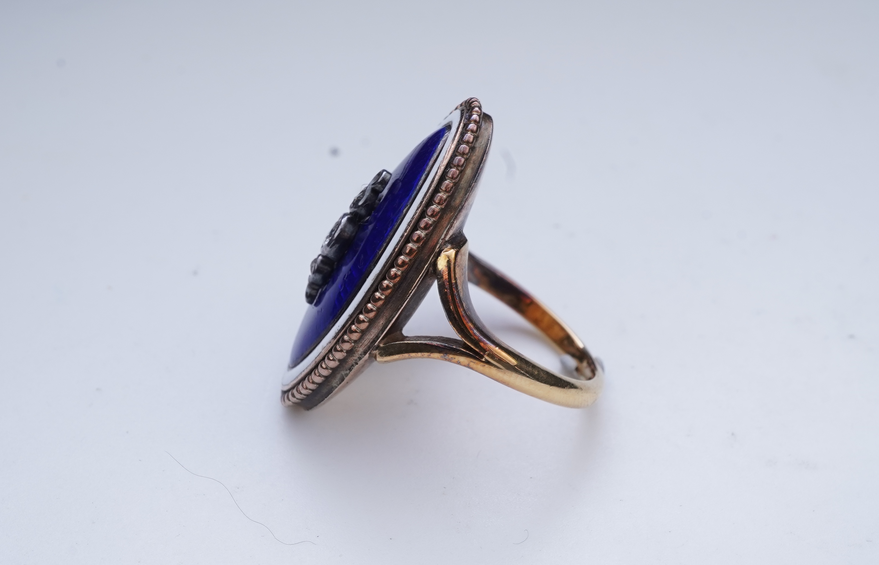 An enamel and diamond mourning ring, late 19th century